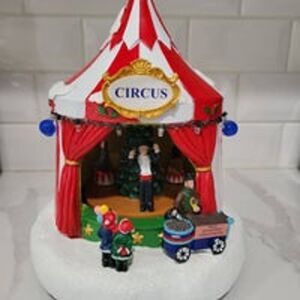 St. Nicholas Square Village Circus tent with lights, music, and motion